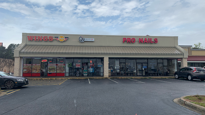 Wireless Inc storefront on Airport Thruway in Columbus, GA, between Wings and Pro Nails