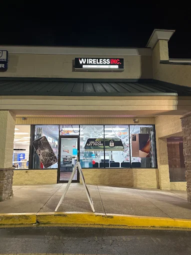Wireless Inc storefront and Unlock Any Phone sign in Stadium Plaza, Phenix City, AL